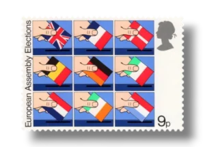 Hands placing National flags into Ballot Boxes